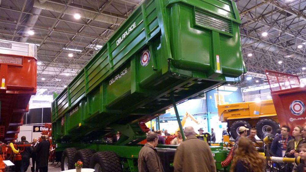 Une benne à hauteur de chargement variable Une benne à hauteur de chargement variable